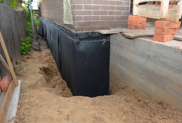 SJ Waterproofing Pros technician performing targeted Emergency Waterproofing assessment in Chalmers, IN